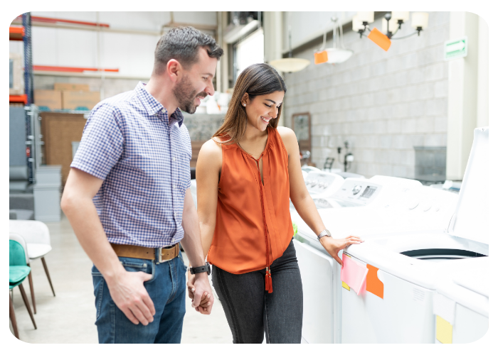 Couple shopping for washing machine