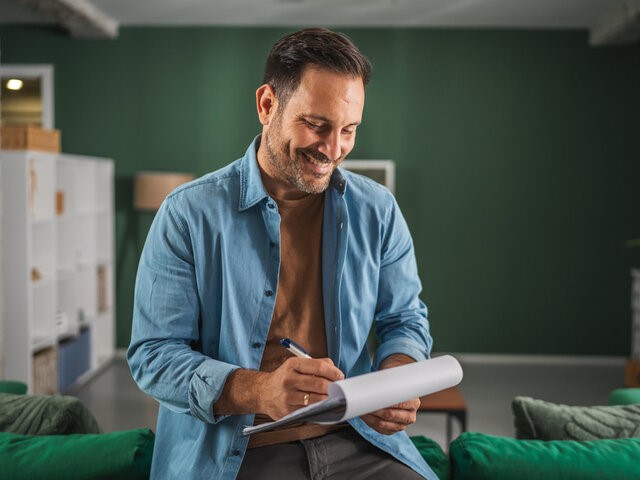 Man holding clipboard checklist
