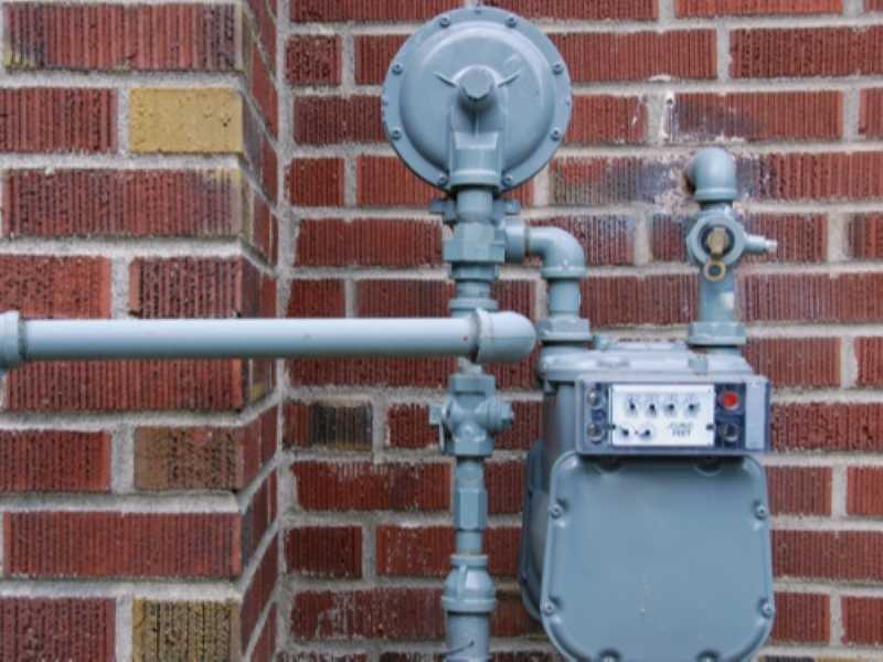 gas meter outside of a brick home