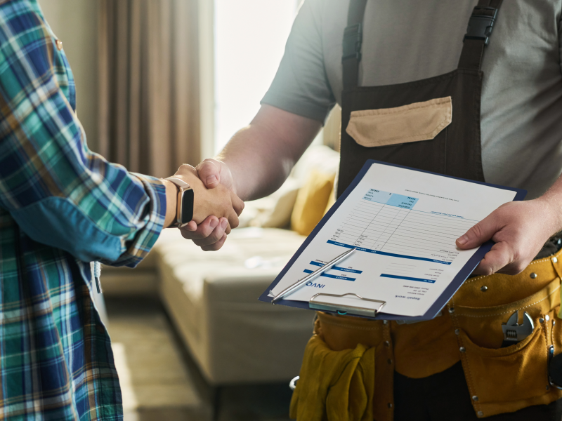 Contractor shaking customers hand